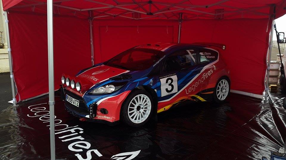 Rally Car Under Exhibition Tent on Black PVC Ground Sheet